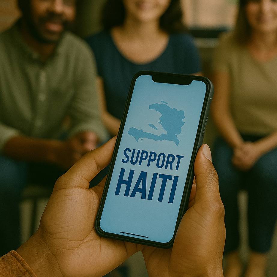 A person sharing a “Support Haiti” advocacy message on a smartphone during a community awareness effort